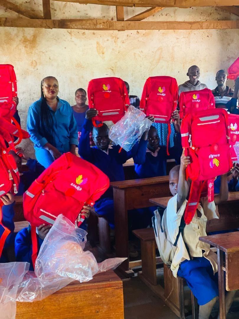 Pupils in Rukwa receiving school bags through the NIWEZESHE programme